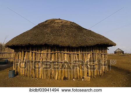 Picture - "Round hut made of tree trunks, village, Swaziland, Africa". Fotosearch