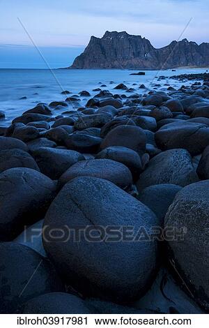Stock Image - "Round stones on the beach of Utakleiv, Vestvagoy, Lofoten, Norway, Europe". Fotosearch