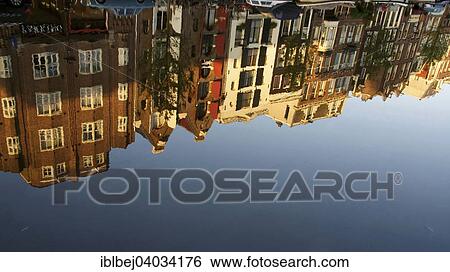 "Row of houses reflected in a canal, Amsterdam, province of North Holland, Holland, The Netherlands, Europe" View Large Photo Image Stock Photograph - "Row of houses reflected in a canal, Amsterdam, province of North Holland, Holland, The Netherlands, Europe". Fotosearch