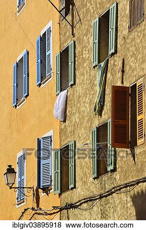 "Row of houses with colourful shutters, L'Ile Rousse, Balagne, Corsica, France, Europe" View Large Photo Image Stock Photo - "Row of houses with colourful shutters, L'Ile Rousse, Balagne, Corsica, France, Europe". Fotosearch