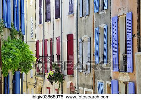 "Row of houses with colourful shutters in the historic centre of Valensole, Departement Alpes-de-Haute-Provence, Provence-Alpes-Cote d'Azur, France, Europe" View Large Photo Image Stock Photograph - "Row of houses with colourful shutters in the historic centre of Valensole, Departement Alpes-de-Haute-Provence, Provence-Alpes-Cote d'Azur, France, Europe". Fotosearch