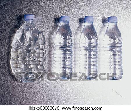 "Row of plastic bottles, one flattened by being driven over" View Large Photo Image Stock Image - "Row of plastic bottles, one flattened by being driven over". Fotosearch