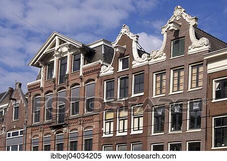 Stock Photography - "Row of traditional houses on a canal, Amsterdam, province of North Holland, Holland, The Netherlands, Europe". Fotosearch