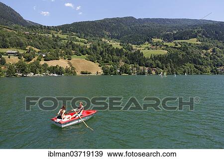 "Rowboat on Brennsee or Feldsee lake, Feld am See, Carinthia, Austria, Europe" View Large Photo Image Stock Photo - "Rowboat on Brennsee or Feldsee lake, Feld am See, Carinthia, Austria, Europe". Fotosearch