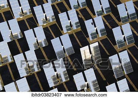 "Rows of solar panels, so-called heliostats, generating energy at a solar energy field in the Tabernas Desert, Almeria province, Andalucia, Spain, Europe" View Large Photo Image Stock Photo - "Rows of solar panels, so-called heliostats, generating energy at a solar energy field in the Tabernas Desert, Almeria province, Andalucia, Spain, Europe". Fotosearch