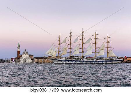 Stock Photo - "Royal Clipper, a five-masted tall ship sailing in front of the Church of San Giorgio Maggiore, on the Canale della Giudecca, Venice, Italy, Europe". Fotosearch