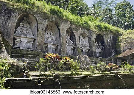 "Royal tombs of Gunung Kawi, stone monuments carved into the rock wall, Gunung Kawi, Tampaksiring, Bali, Indonesia, Asia" View Large Photo Image Stock Image - "Royal tombs of Gunung Kawi, stone monuments carved into the rock wall, Gunung Kawi, Tampaksiring, Bali, Indonesia, Asia". Fotosearch
