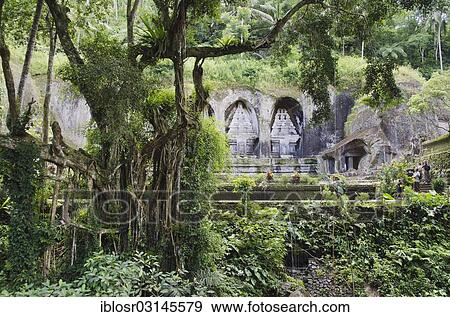 "Royal tombs of Gunung Kawi, stone monuments carved into the rock wall, Gunung Kawi, Tampaksiring, Bali, Indonesia, Asia" View Large Photo Image Stock Photo - "Royal tombs of Gunung Kawi, stone monuments carved into the rock wall, Gunung Kawi, Tampaksiring, Bali, Indonesia, Asia". Fotosearch