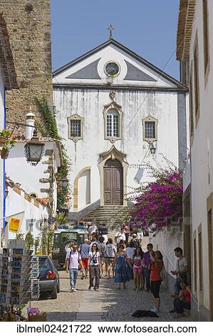 Stock Image - Rua Direita with Igreja de Sao Tiago, Sai Tiago Church, Castelo de Obidos, Obidos Castle, Obidos, Leiria District, Pinhal Litoral, Portugal, Europe. Fotosearch