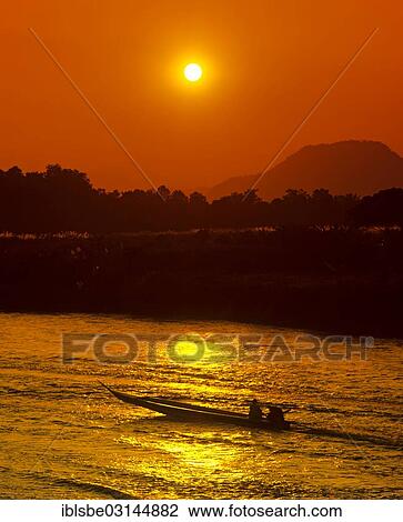 "Ruea Hang Yao or long tail boat, speedboat on the Kok River, at sunset, Chiang Rai, Chiang Rai Province, Northern Thailand, Thailand, Asia" View Large Photo Image Stock Image - "Ruea Hang Yao or long tail boat, speedboat on the Kok River, at sunset, Chiang Rai, Chiang Rai Province, Northern Thailand, Thailand, Asia". Fotosearch