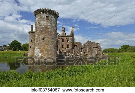 "Ruins of Caerlaverock Castle, the only triangular-shaped moated castle in Scotland, seat of the Maxwell clan, Dumfries and Galloway, Scotland" View Large Photo Image Stock Photo - "Ruins of Caerlaverock Castle, the only triangular-shaped moated castle in Scotland, seat of the Maxwell clan, Dumfries and Galloway, Scotland". Fotosearch