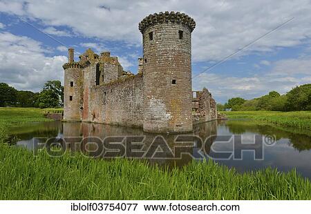 "Ruins of Caerlaverock Castle, the only triangular-shaped moated castle in Scotland, seat of the Maxwell clan, Dumfries and Galloway, Scotland" View Large Photo Image Stock Photo - "Ruins of Caerlaverock Castle, the only triangular-shaped moated castle in Scotland, seat of the Maxwell clan, Dumfries and Galloway, Scotland". Fotosearch