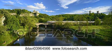 "Ruins of Rudelsburg Castle and Burg Saaleck Castle on the Saale River with an ICE train crossing a railway bridge, near Bad Kosen, Saxony-Anhalt, Germany, Europe" View Large Photo Image Stock Photograph - "Ruins of Rudelsburg Castle and Burg Saaleck Castle on the Saale River with an ICE train crossing a railway bridge, near Bad Kosen, Saxony-Anhalt, Germany, Europe". Fotosearch