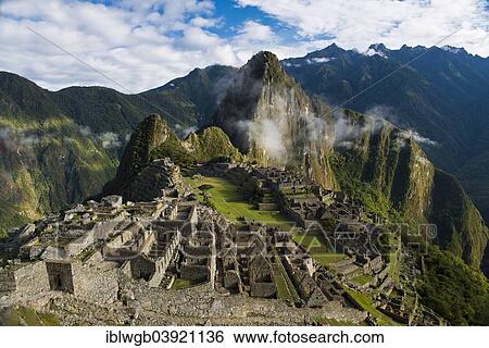 Stock Photograph - "Ruins, the Inca city of Machu Picchu with Huayna Picchu mountain, UNESCO World Heritage Site, Urubamba Valley, near Cusco, Andes, Peru, South America". Fotosearch