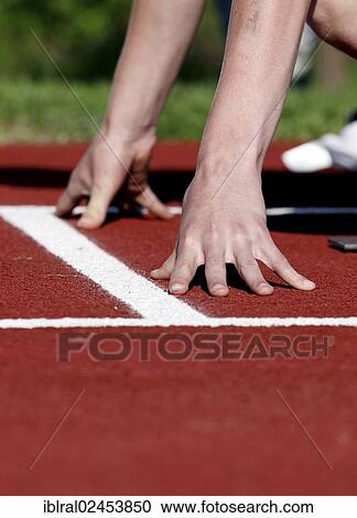 "Runner at the starting position on a track, athletics" View Large Photo Image Stock Image - "Runner at the starting position on a track, athletics". Fotosearch