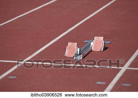 Stock Photograph - Running track and starting block. Fotosearch