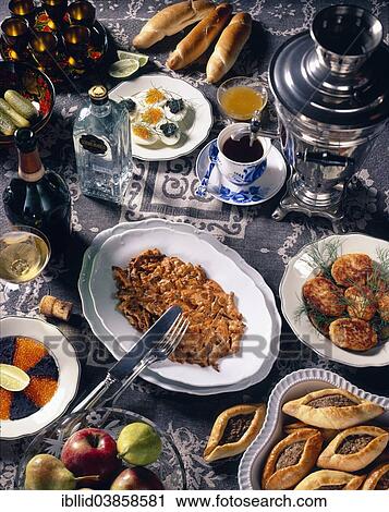 "Russian national cuisine, caviar, pirogues, potato schnitzel, beef stroganoff, eggs with caviar, black tea with a samovar, vodka" View Large Photo Image Stock Image - "Russian national cuisine, caviar, pirogues, potato schnitzel, beef stroganoff, eggs with caviar, black tea with a samovar, vodka". Fotosearch