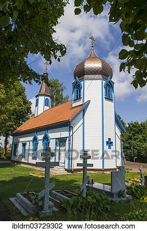 Stock Image - "Russian Orthodox church with an onion dome, a wooden church built in the Byzantine style of sacred architecture, Wojnowo, Warmian-Masurian Voivodeship, Poland, Europe". Fotosearch