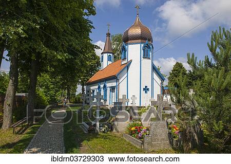 Stock Image - "Russian Orthodox church with an onion dome, a wooden church built in the Byzantine style of sacred architecture, Wojnowo, Warmian-Masurian Voivodeship, Poland, Europe". Fotosearch