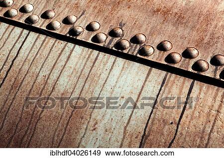Stock Photo - Rusted metal construction with rivets. Fotosearch