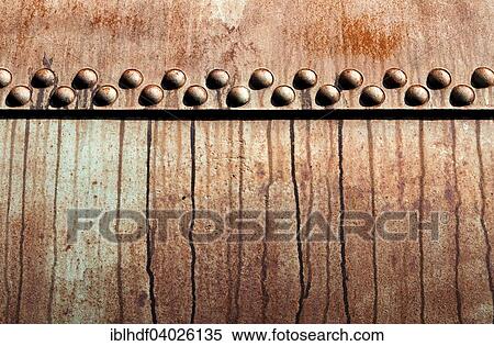 Rusted metal construction with rivets View Large Photo Image Stock Photography - Rusted metal construction with rivets. Fotosearch