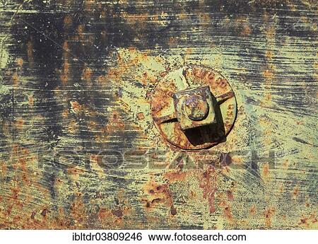 Stock Photograph - "Rusty bolts and weathered colours on a wagon, ghost town of Rhyolite, Nevada, USA". Fotosearch