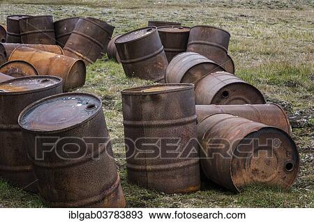 Stock Image - "Rusty drums in the tundra, Chukotka Autonomous Okrug, Russia, Europe". Fotosearch