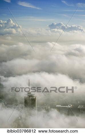 "RWE Tower amidst the clouds, aerial view, Essen, Ruhr area, North Rhine-Westphalia, Germany, Europe" View Large Photo Image Stock Image - "RWE Tower amidst the clouds, aerial view, Essen, Ruhr area, North Rhine-Westphalia, Germany, Europe". Fotosearch
