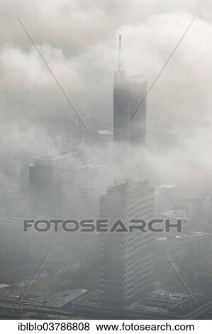 "RWE Tower amidst the clouds, aerial view, Essen, Ruhr area, North Rhine-Westphalia, Germany, Europe" View Large Photo Image Stock Photo - "RWE Tower amidst the clouds, aerial view, Essen, Ruhr area, North Rhine-Westphalia, Germany, Europe". Fotosearch