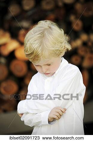 "Sad five-year-old boy, looking down" View Large Photo Image Stock Image - "Sad five-year-old boy, looking down". Fotosearch