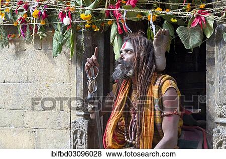 "Sadhu, Holy Man, practicing yoga opposite the burning ghats, Kathmandu, Kathmandu District, Bagmati Zone, Nepal, Asia" View Large Photo Image Stock Photo - "Sadhu, Holy Man, practicing yoga opposite the burning ghats, Kathmandu, Kathmandu District, Bagmati Zone, Nepal, Asia". Fotosearch