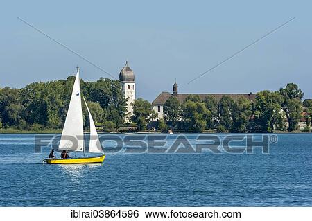 "Sailboat in front of the bell tower of Frauenworth Abbey, Frauenchiemsee Island, Lake Chiemsee, Chiemgau, Upper Bavaria, Bavaria, Germany, Europe" View Large Photo Image Stock Photograph - "Sailboat in front of the bell tower of Frauenworth Abbey, Frauenchiemsee Island, Lake Chiemsee, Chiemgau, Upper Bavaria, Bavaria, Germany, Europe". Fotosearch