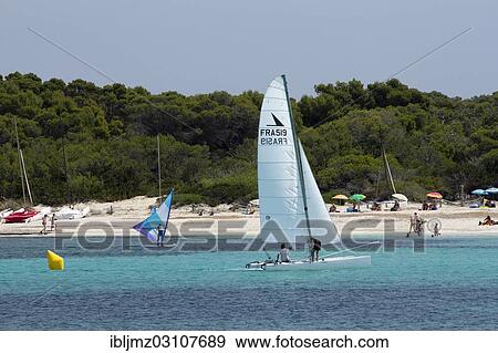 "Sailboat off the beach of Platja Es Trenc, Colonia de Sant Jordi, Mallorca, Majorca, Balearic Islands, Spain, Europe" View Large Photo Image Stock Photo - "Sailboat off the beach of Platja Es Trenc, Colonia de Sant Jordi, Mallorca, Majorca, Balearic Islands, Spain, Europe". Fotosearch