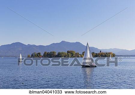 "Sailboats on Lake Chiemsee Fraueninsel island, behind the Chiemgau Alps, Chiemgau, Upper Bavaria, Bavaria, Germany, Europe" View Large Photo Image Stock Image - "Sailboats on Lake Chiemsee Fraueninsel island, behind the Chiemgau Alps, Chiemgau, Upper Bavaria, Bavaria, Germany, Europe". Fotosearch