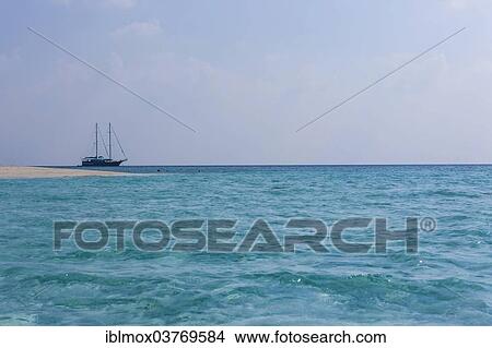 Picture - "Sailing boat in a lagoon, North Male Atoll, Maldives, Asia". Fotosearch