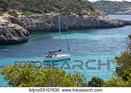 "Sailing boat in the rocky bay of Calo d'en Garrot, Parc Natural de Mondrago, Mallorca, Majorca, Balearic Islands, Spain, Europe" View Large Photo Image Stock Photography - "Sailing boat in the rocky bay of Calo d'en Garrot, Parc Natural de Mondrago, Mallorca, Majorca, Balearic Islands, Spain, Europe". Fotosearch