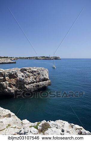 "Sailing boat off a rocky coast, cliffs, Cala Marcal, Mallorca, Majorca, Balearic Islands, Spain, Europe" View Large Photo Image Stock Photograph - "Sailing boat off a rocky coast, cliffs, Cala Marcal, Mallorca, Majorca, Balearic Islands, Spain, Europe". Fotosearch