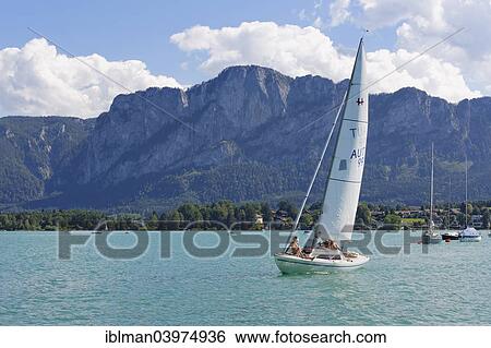 "Sailing boat on Mondsee Lake with Mt Drachenwand, Salzkammergut, Upper Austria, Austria, Europe" View Large Photo Image Stock Photograph - "Sailing boat on Mondsee Lake with Mt Drachenwand, Salzkammergut, Upper Austria, Austria, Europe". Fotosearch