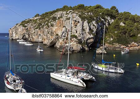 Picture - "Sailing boats and yachts in Cales Coves Bay, Minorca, Balearic Islands, Spain, Europe". Fotosearch