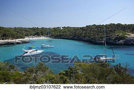 "Sailing boats at sandy beach of Calo d'en Garrot, Parc Natural de Mondrago, Mallorca, Majorca, Balearic Islands, Spain, Europe" View Large Photo Image Stock Image - "Sailing boats at sandy beach of Calo d'en Garrot, Parc Natural de Mondrago, Mallorca, Majorca, Balearic Islands, Spain, Europe". Fotosearch