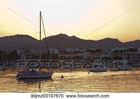 "Sailing boats in a harbour at sunset, Portocolom, Mallorca, Majorca, Balearic Islands, Spain, Europe" View Large Photo Image Stock Image - "Sailing boats in a harbour at sunset, Portocolom, Mallorca, Majorca, Balearic Islands, Spain, Europe". Fotosearch