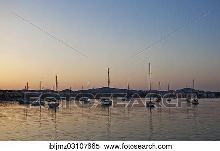 "Sailing boats in a harbour at sunset, Portocolom, Mallorca, Majorca, Balearic Islands, Spain, Europe" View Large Photo Image Stock Photography - "Sailing boats in a harbour at sunset, Portocolom, Mallorca, Majorca, Balearic Islands, Spain, Europe". Fotosearch