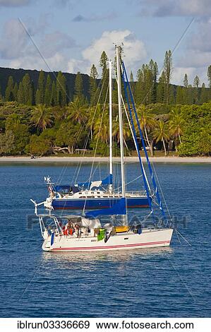 Stock Photo - "Sailing boats in the Bay de Kuto, Ile des Pins, New Caledonia, France, Oceania". Fotosearch