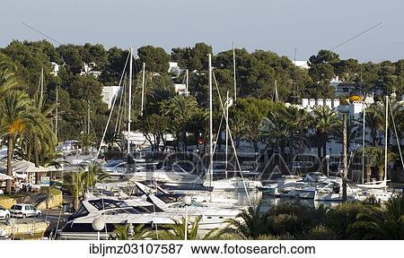 "Sailing boats in the harbour of Cala Llonga, Cala d'Or, Mallorca, Majorca, Balearic Islands, Spain, Europe" View Large Photo Image Stock Photo - "Sailing boats in the harbour of Cala Llonga, Cala d'Or, Mallorca, Majorca, Balearic Islands, Spain, Europe". Fotosearch