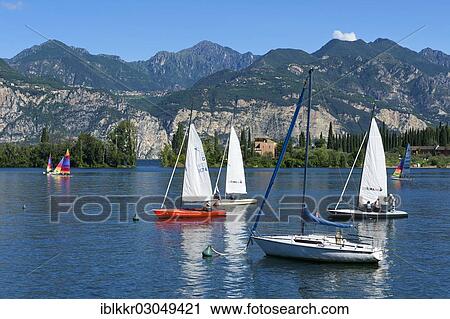 "Sailing boats on Lake Garda, Malcesine, Italy, Europe" View Large Photo Image Stock Image - "Sailing boats on Lake Garda, Malcesine, Italy, Europe". Fotosearch