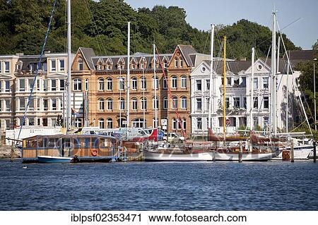 "Sailing boats on the harbour promenade, Flensburg, Schleswig-Holstein, Germany, Europe" View Large Photo Image Stock Image - "Sailing boats on the harbour promenade, Flensburg, Schleswig-Holstein, Germany, Europe". Fotosearch