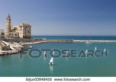 "Sailing school in the harbor with Trani Cathedral, 11th century, Trani, Bari Province, Apulia, Italy, Europe" View Large Photo Image Stock Photography - "Sailing school in the harbor with Trani Cathedral, 11th century, Trani, Bari Province, Apulia, Italy, Europe". Fotosearch