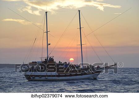 "Sailing ship at sunset near Oia, Santorini, Cyclades, Greek Islands, Greece, Europe" View Large Photo Image Picture - "Sailing ship at sunset near Oia, Santorini, Cyclades, Greek Islands, Greece, Europe". Fotosearch
