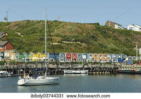 "Sailing ship in the harbour of Heligoland or Helgoland in front of Hummerbuden or lobster shacks, Helgoland, Schleswig-Holstein, Germany, Europe" View Large Photo Image Stock Image - "Sailing ship in the harbour of Heligoland or Helgoland in front of Hummerbuden or lobster shacks, Helgoland, Schleswig-Holstein, Germany, Europe". Fotosearch