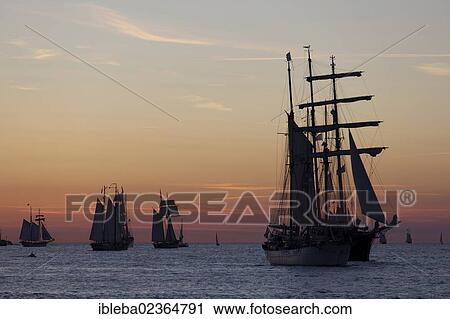"Sailing ships against an atmospheric evening sky, Hanse Sail 2012, Warnemuende, Mecklenburg-Western Pomerania, Germany, Europe" View Large Photo Image Stock Image - "Sailing ships against an atmospheric evening sky, Hanse Sail 2012, Warnemuende, Mecklenburg-Western Pomerania, Germany, Europe". Fotosearch